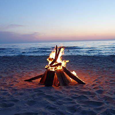 Bonfire on the sand near the ocean